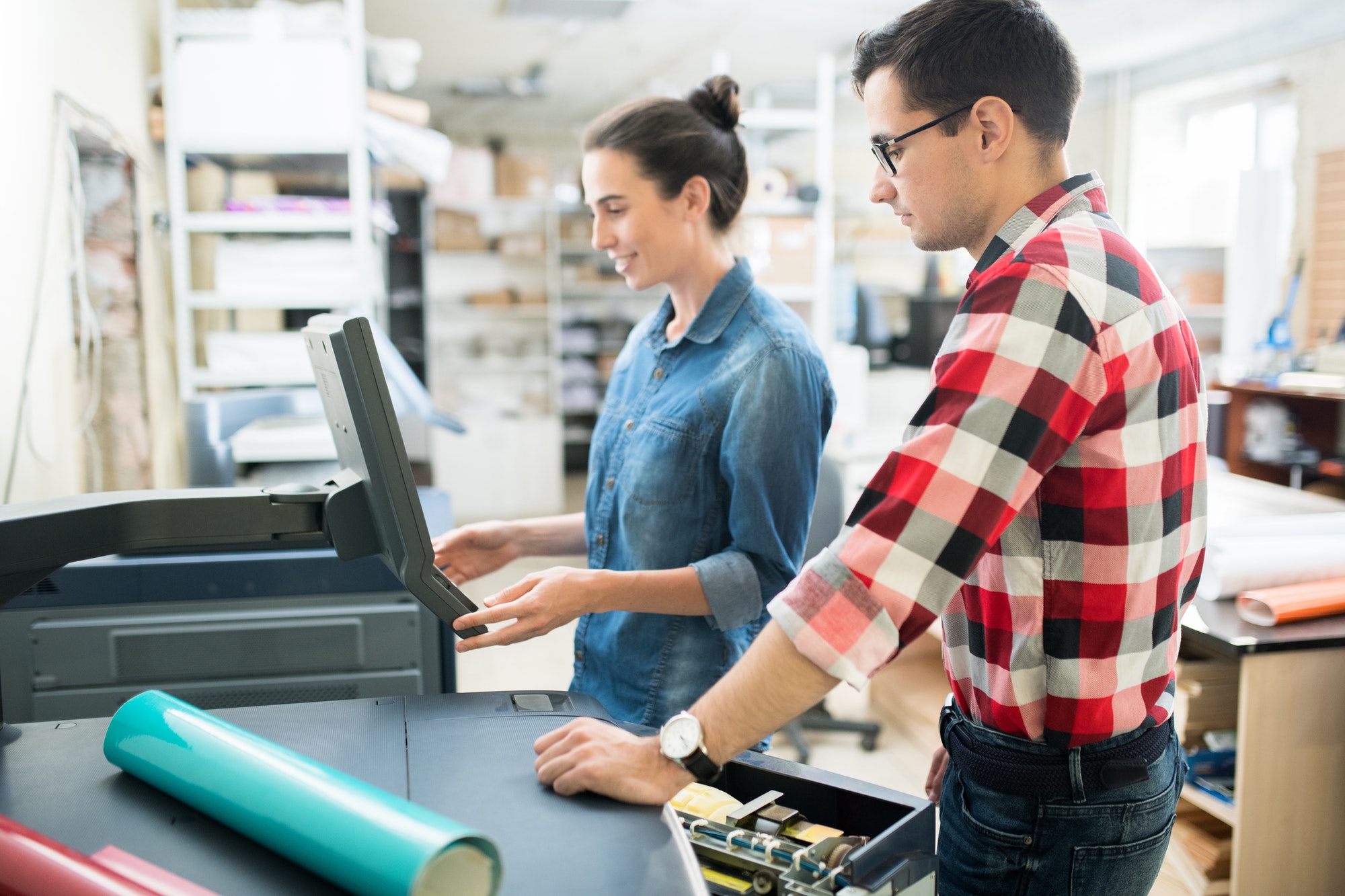 smiling lady viewing information on monitor in printing house.jpg